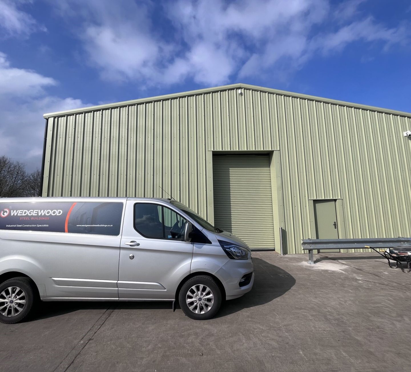 Wedgewood van outside steel building